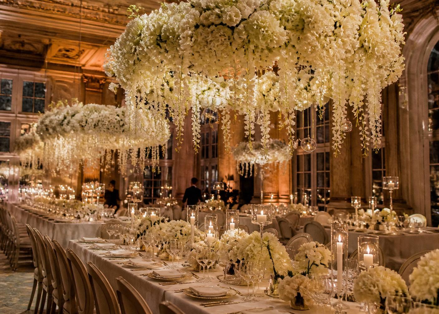 Ballroom reception with hanging floral chandeliers